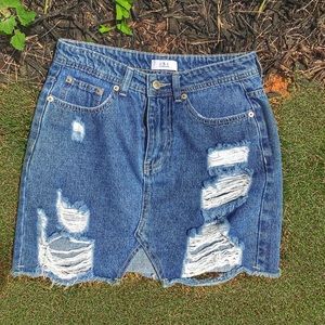 Distressed short denim skirt